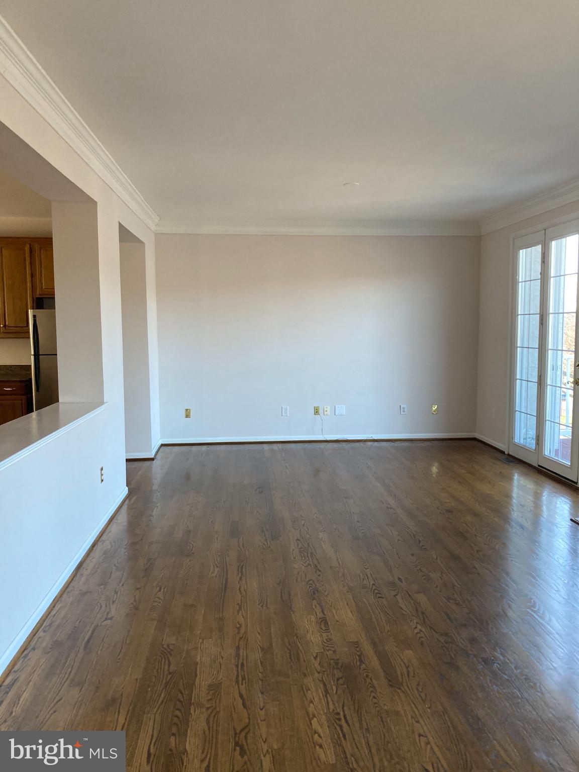 1458 Broad Run Road Landenberg, PA 19350 - Photo 12 of 34 an empty room with wooden floor and windows