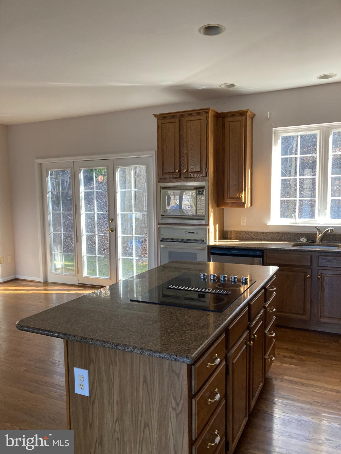 1458 Broad Run Road Landenberg, PA 19350 - Photo 5 of 34 a kitchen with a sink and wooden cabinets