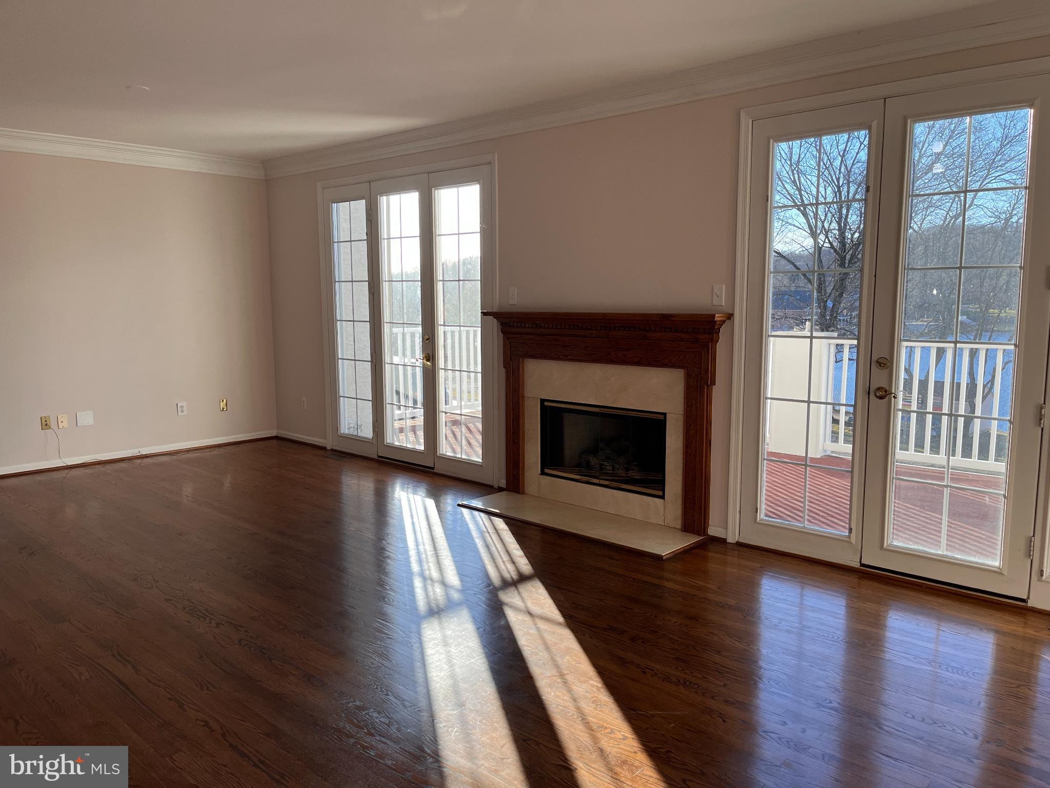1458 Broad Run Road Landenberg, PA 19350 - Photo 10 of 34 wooden floor fireplace and windows in an empty room