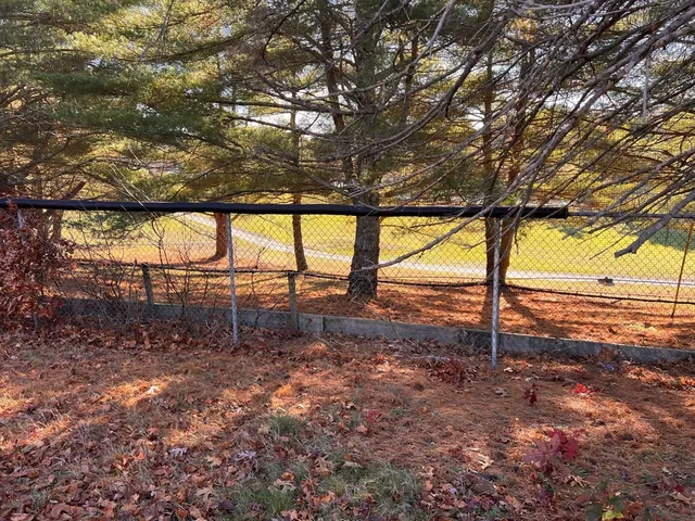 a view of outdoor space with deck and mountain view