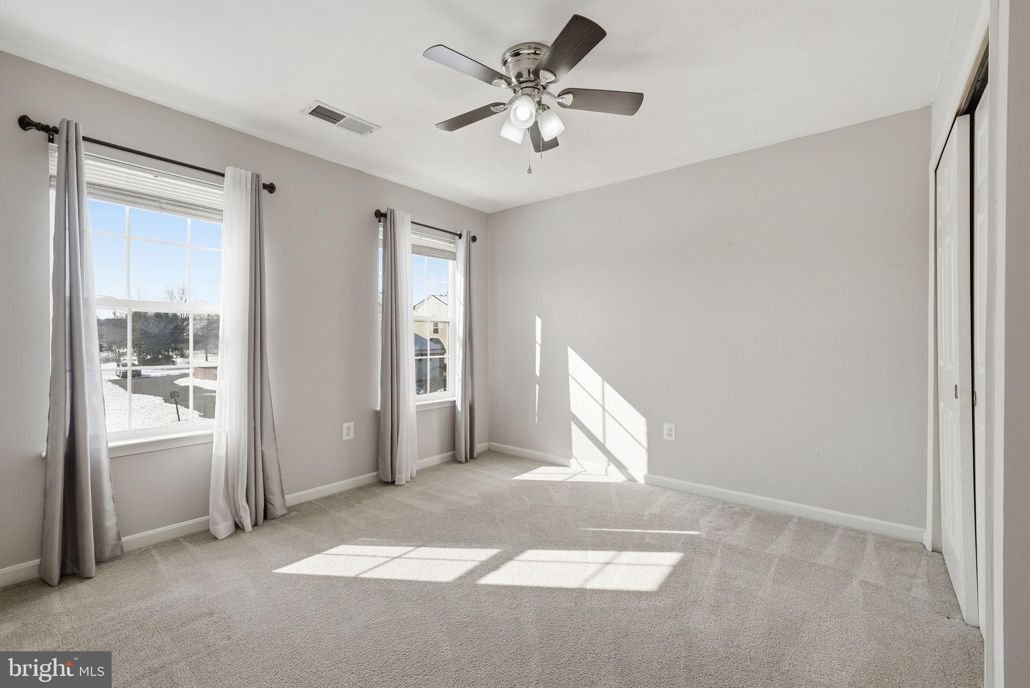 6800 Innesfree Way Gainesville, VA 20155 - Photo 20 of 32 a view of an empty room with a window