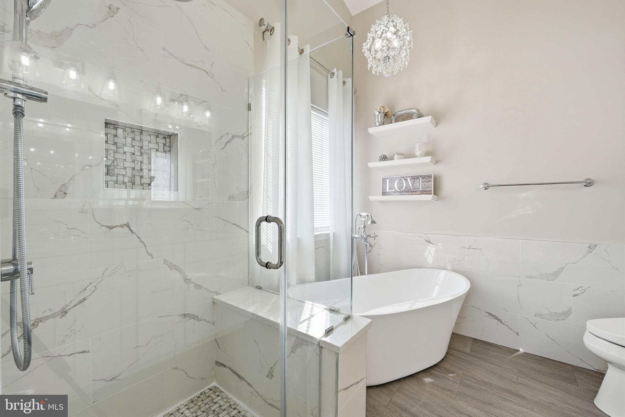 6800 Innesfree Way Gainesville, VA 20155 - Photo 27 of 32 a bathroom with a sink a toilet and shower