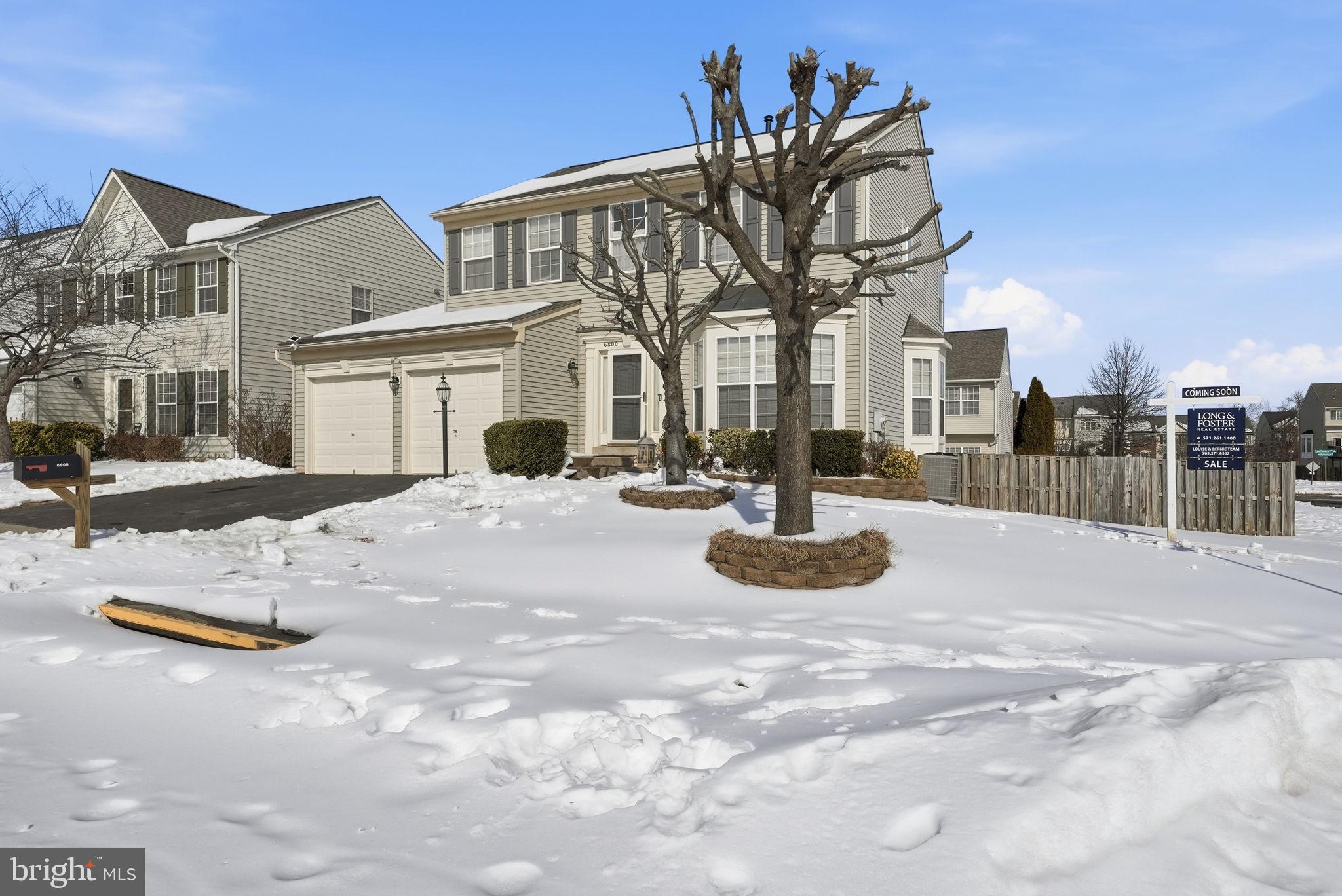 6800 Innesfree Way Gainesville, VA 20155 - Photo 9 of 32 a view of multiple house with large trees