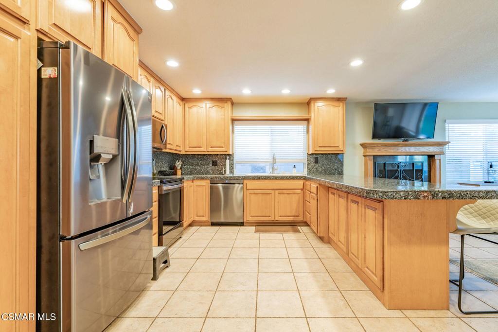 1816 Hillary Court Simi Valley, CA 93065 - Photo 14 of 58 a kitchen with stainless steel appliances a refrigerator sink and microwave