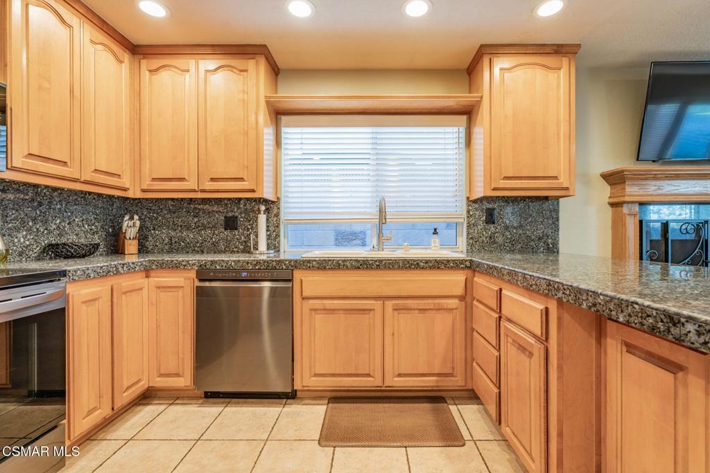 1816 Hillary Court Simi Valley, CA 93065 - Photo 16 of 58 a kitchen with stainless steel appliances granite countertop a sink and a cabinets