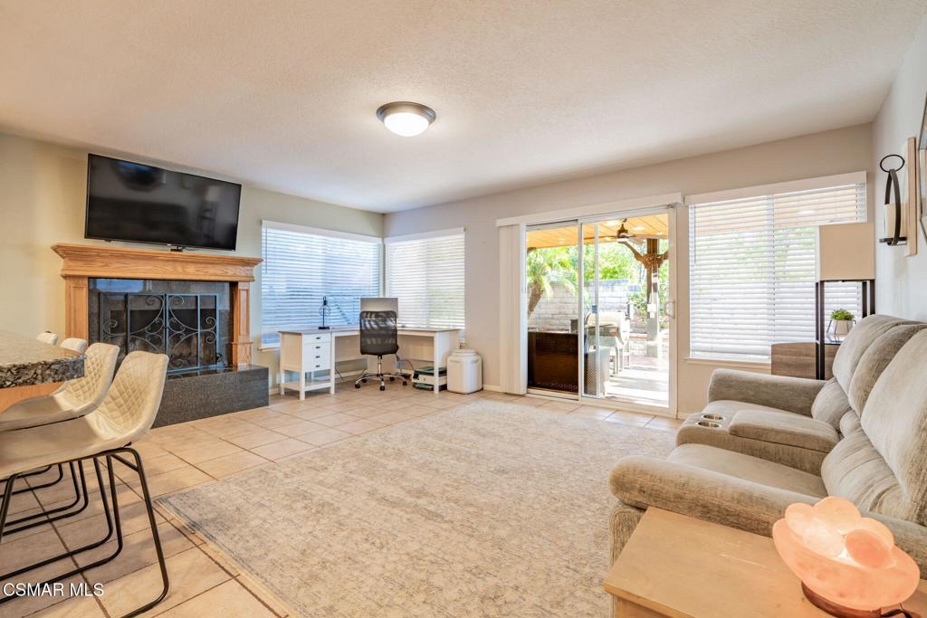 1816 Hillary Court Simi Valley, CA 93065 - Photo 20 of 58 a living room with furniture large window and a fireplace