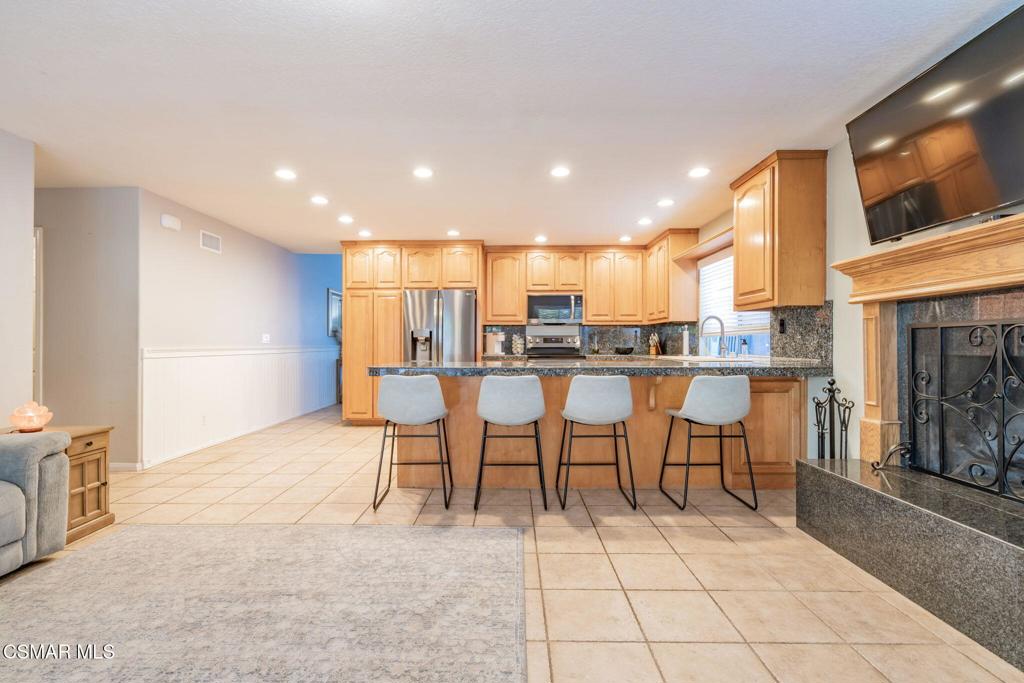 1816 Hillary Court Simi Valley, CA 93065 - Photo 22 of 58 a view of kitchen with kitchen island dining table and chairs