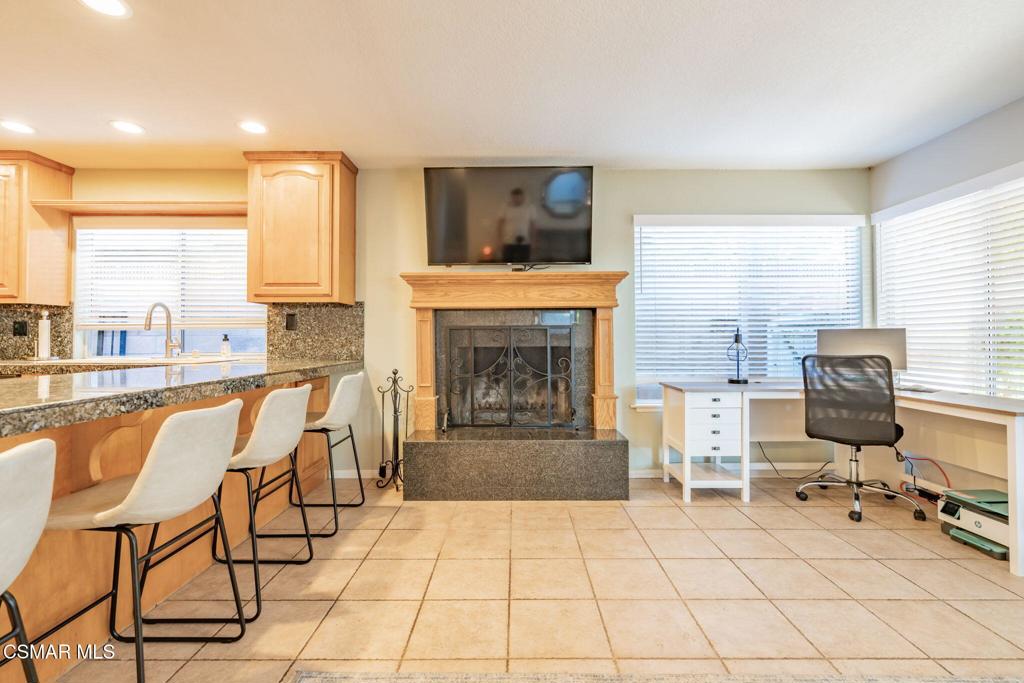 1816 Hillary Court Simi Valley, CA 93065 - Photo 25 of 58 a living room with furniture a fireplace and a flat screen tv
