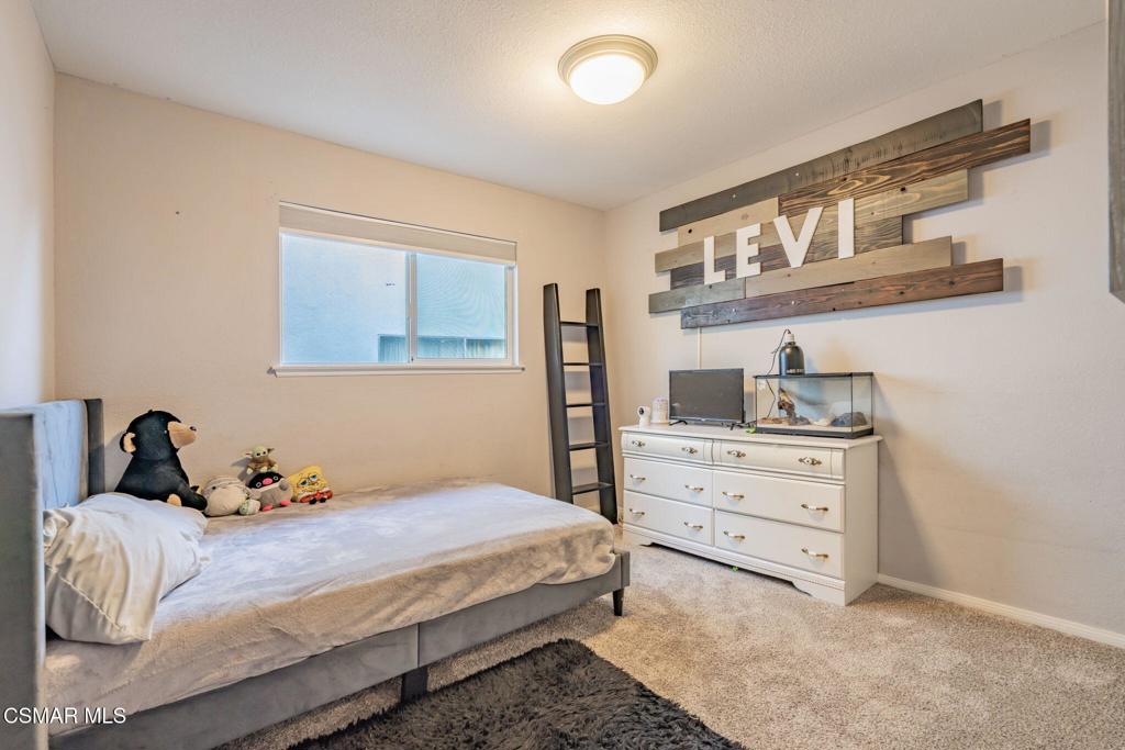 1816 Hillary Court Simi Valley, CA 93065 - Photo 32 of 58 a bedroom with a bed and a cabinets