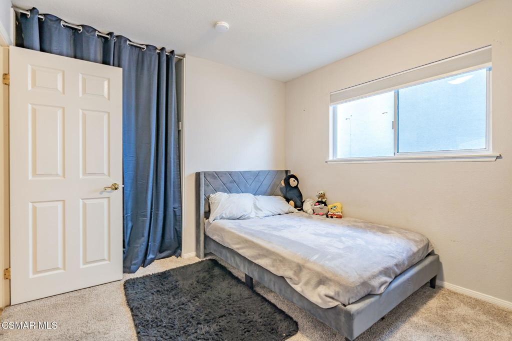 1816 Hillary Court Simi Valley, CA 93065 - Photo 33 of 58 a bedroom with a bed and a window