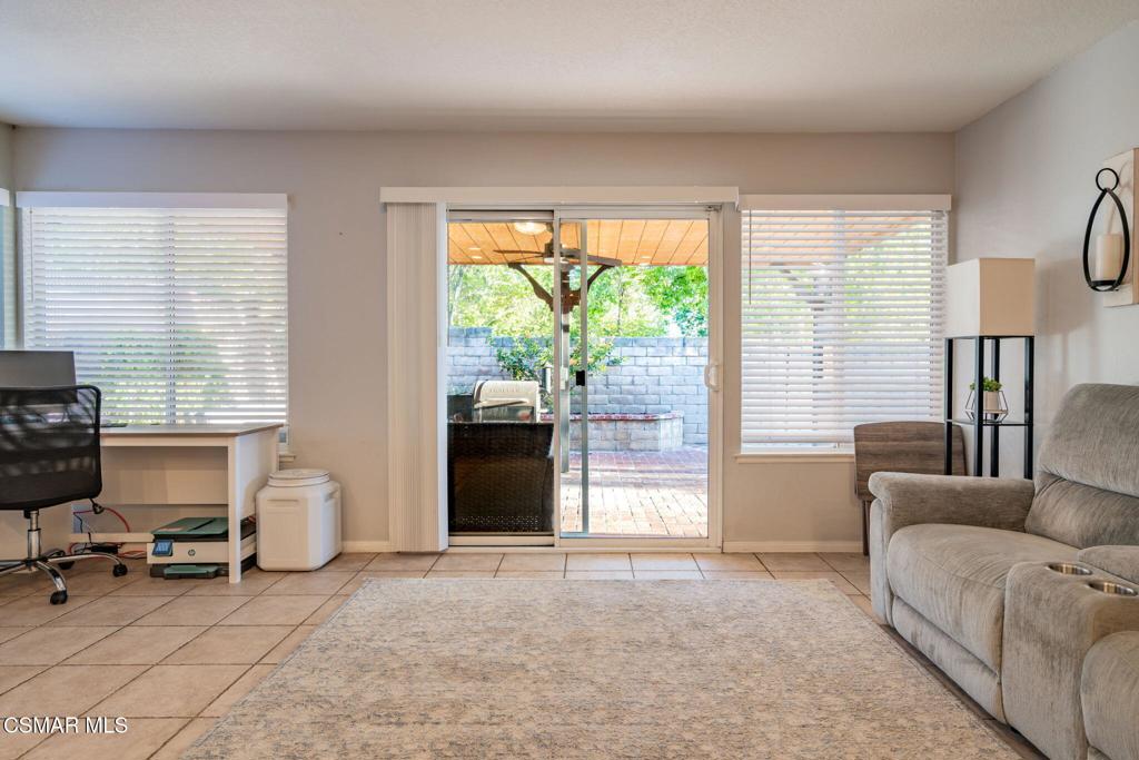 1816 Hillary Court Simi Valley, CA 93065 - Photo 42 of 58 a living room with furniture and a floor to ceiling window