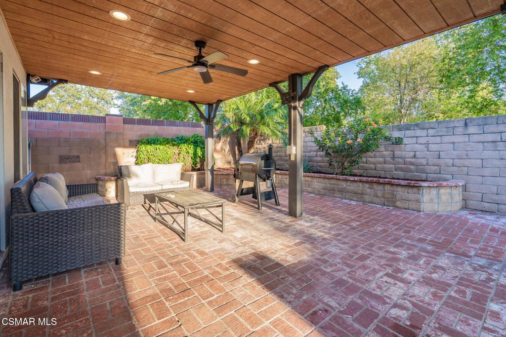 1816 Hillary Court Simi Valley, CA 93065 - Photo 45 of 58 a view of a patio with a table chairs and a backyard