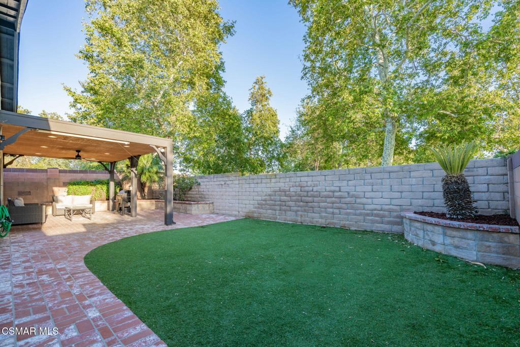 1816 Hillary Court Simi Valley, CA 93065 - Photo 46 of 58 a view of a backyard with a garden