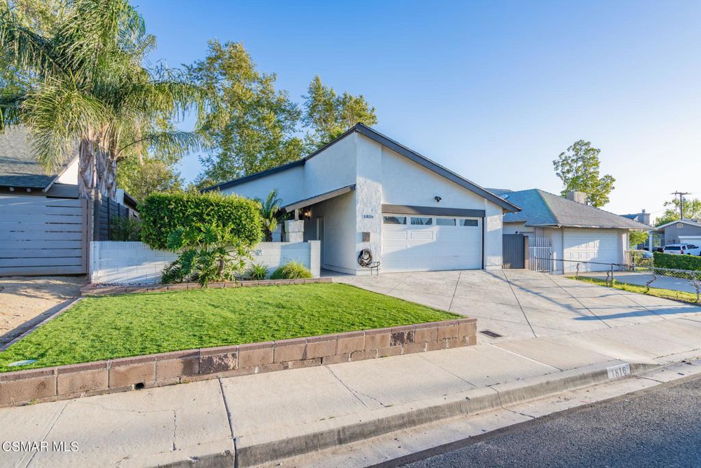 1816 Hillary Court Simi Valley, CA 93065 - Photo 51 of 58 a front view of a house with a yard and a garage