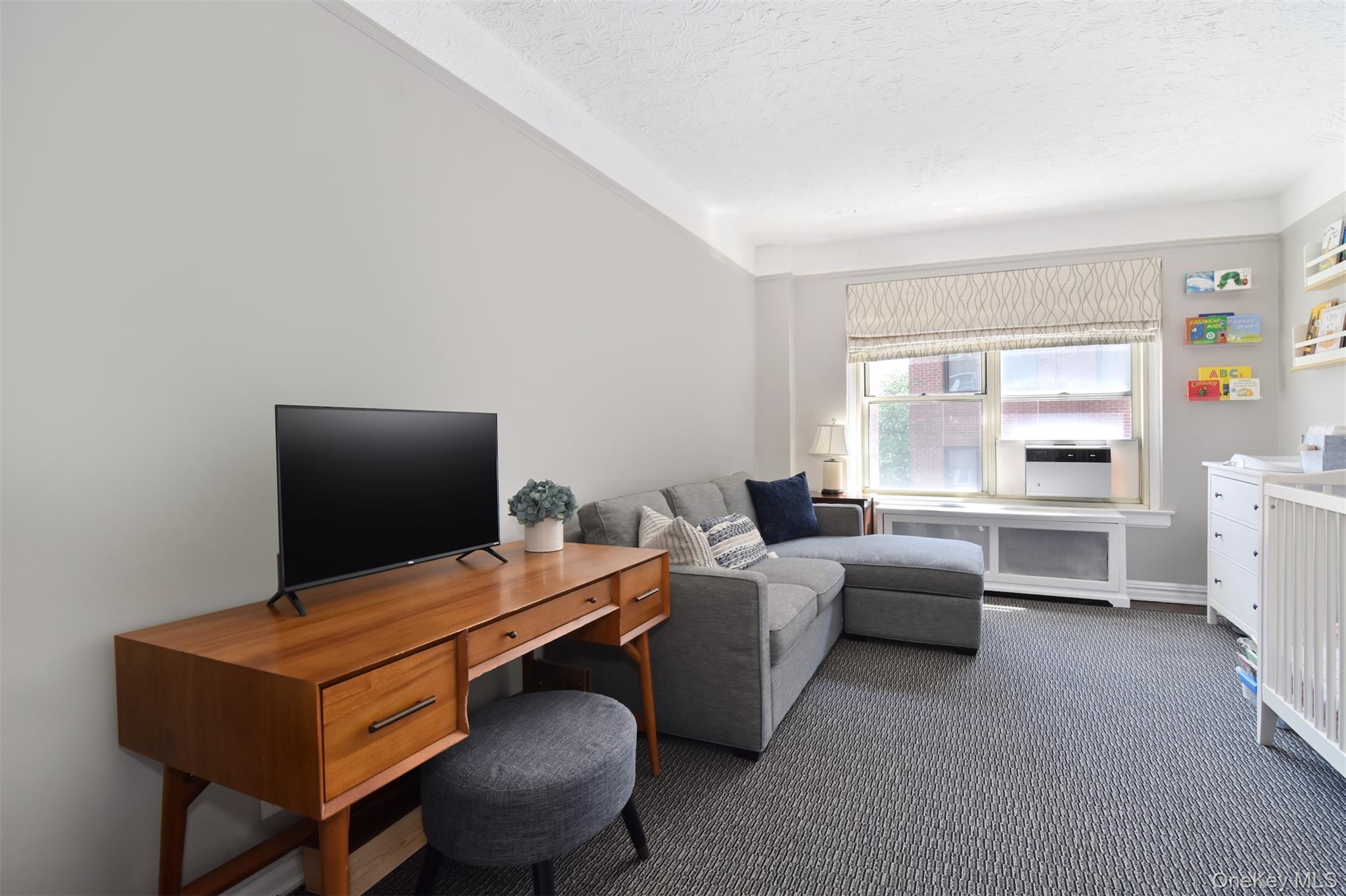 250 Bronxville Road, Unit 3I Bronxville, NY 10708 - Photo 12 of 17 a room with furniture and a window