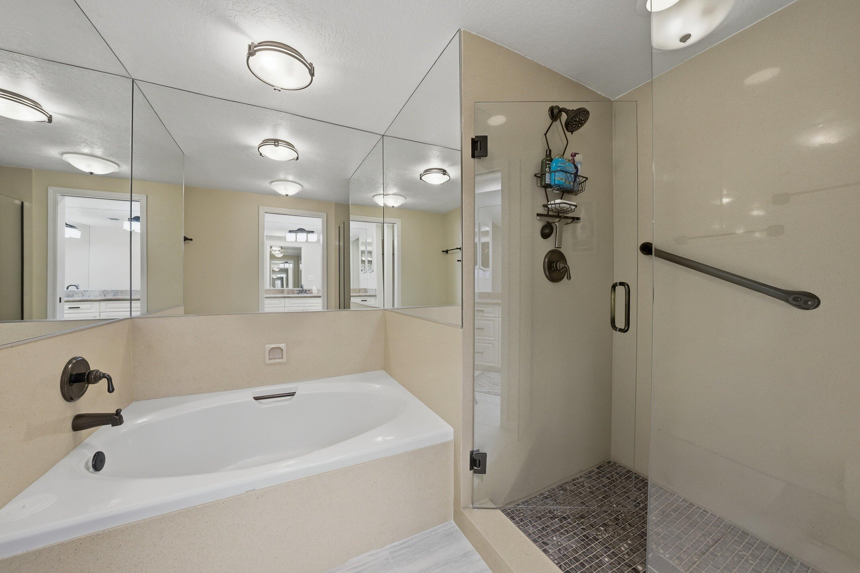19 Maximo Way Palm Desert, CA 92260 - Photo 17 of 20 a bathroom with a bathtub a window and a shower