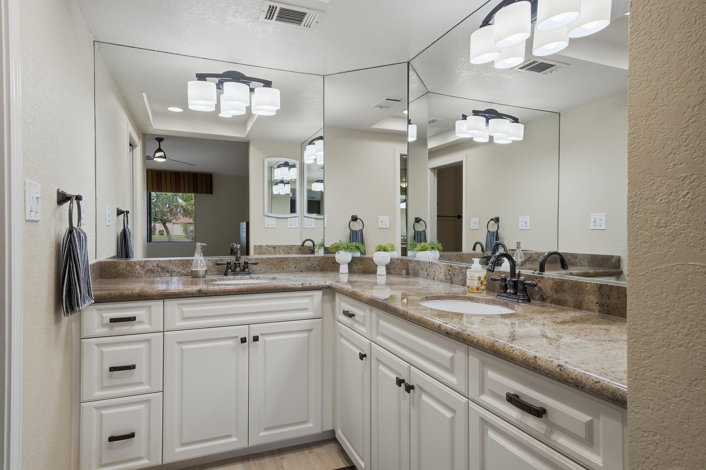19 Maximo Way Palm Desert, CA 92260 - Photo 18 of 20 a bathroom with a granite countertop sink double vanity and a mirror