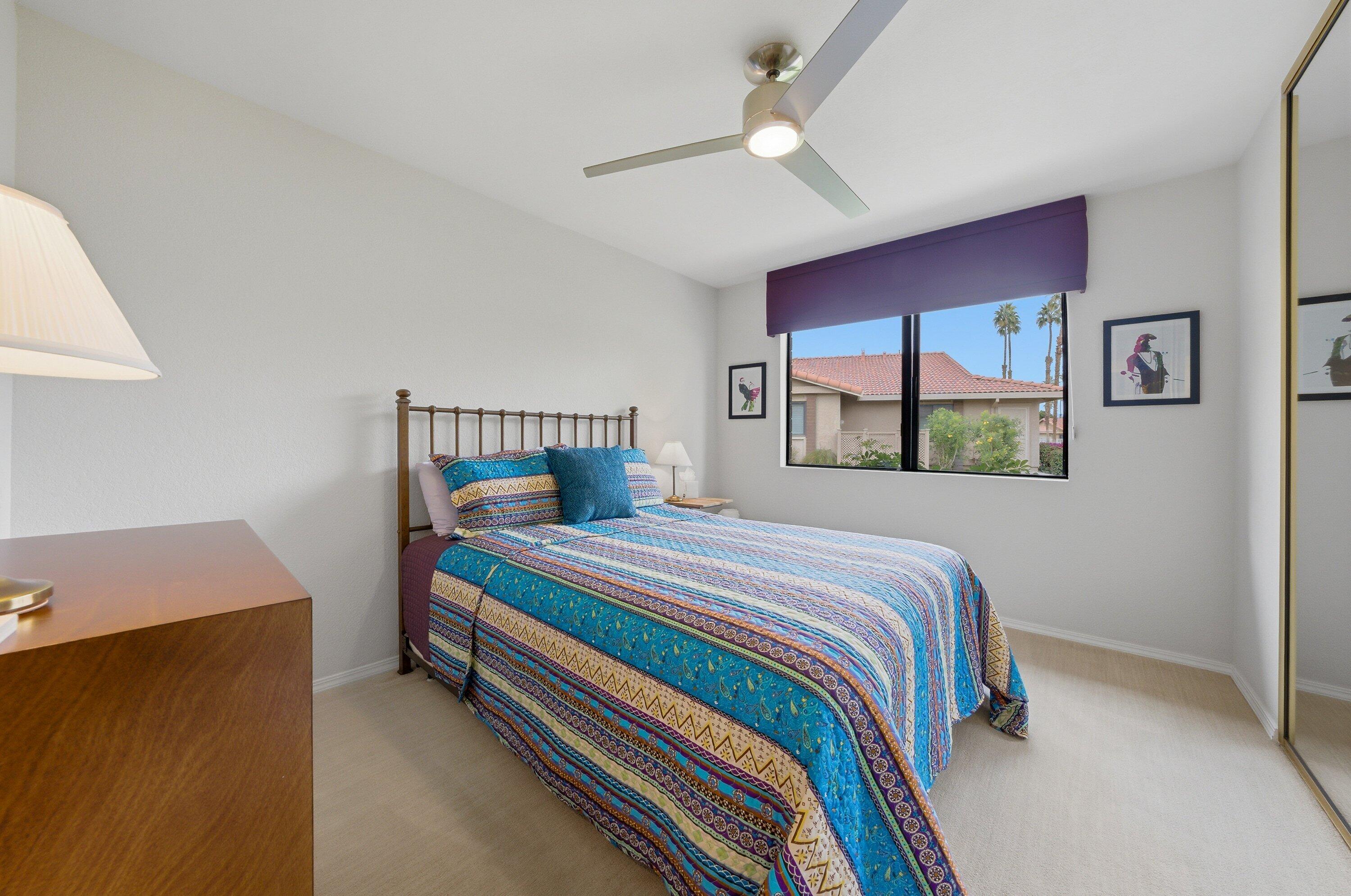 19 Maximo Way Palm Desert, CA 92260 - Photo 19 of 20 a bedroom with a bed and a window