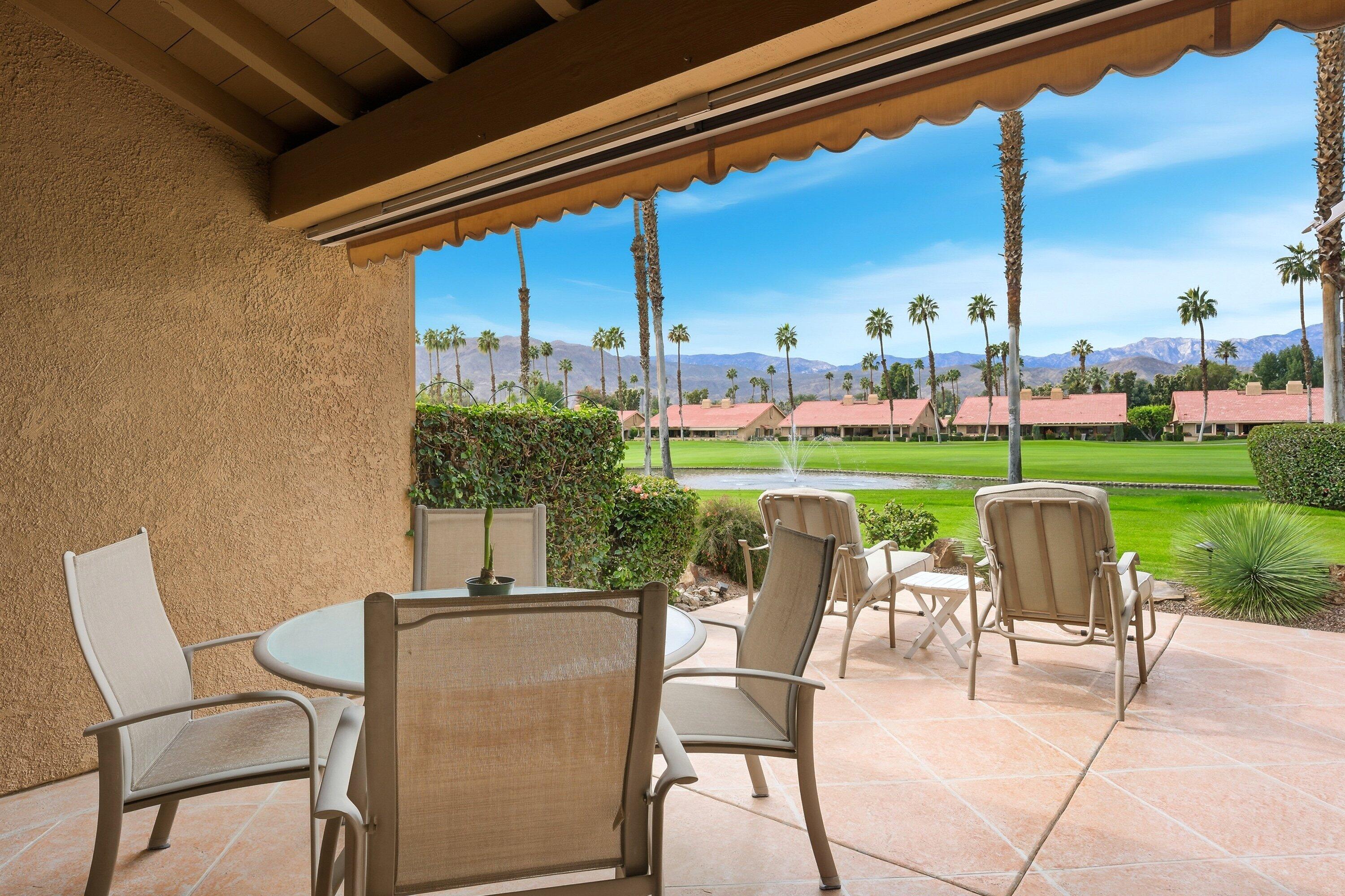 19 Maximo Way Palm Desert, CA 92260 - Photo 2 of 20 a view of a patio with a table chairs and a backyard