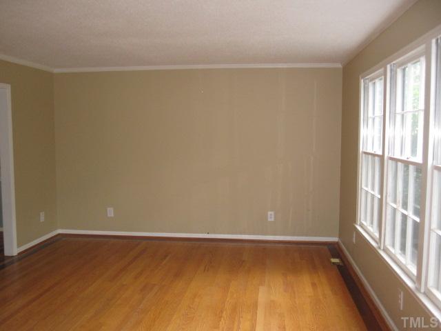 2813 Old Orchard Road Raleigh, NC 27607 - Photo 8 of 11 a view of a room with wooden floor and a window