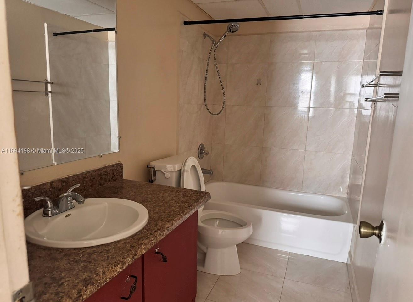 6055 West 19th Avenue, Unit 304 Hialeah, FL 33012 - Photo 1 of 24 a bathroom with a sink toilet and shower