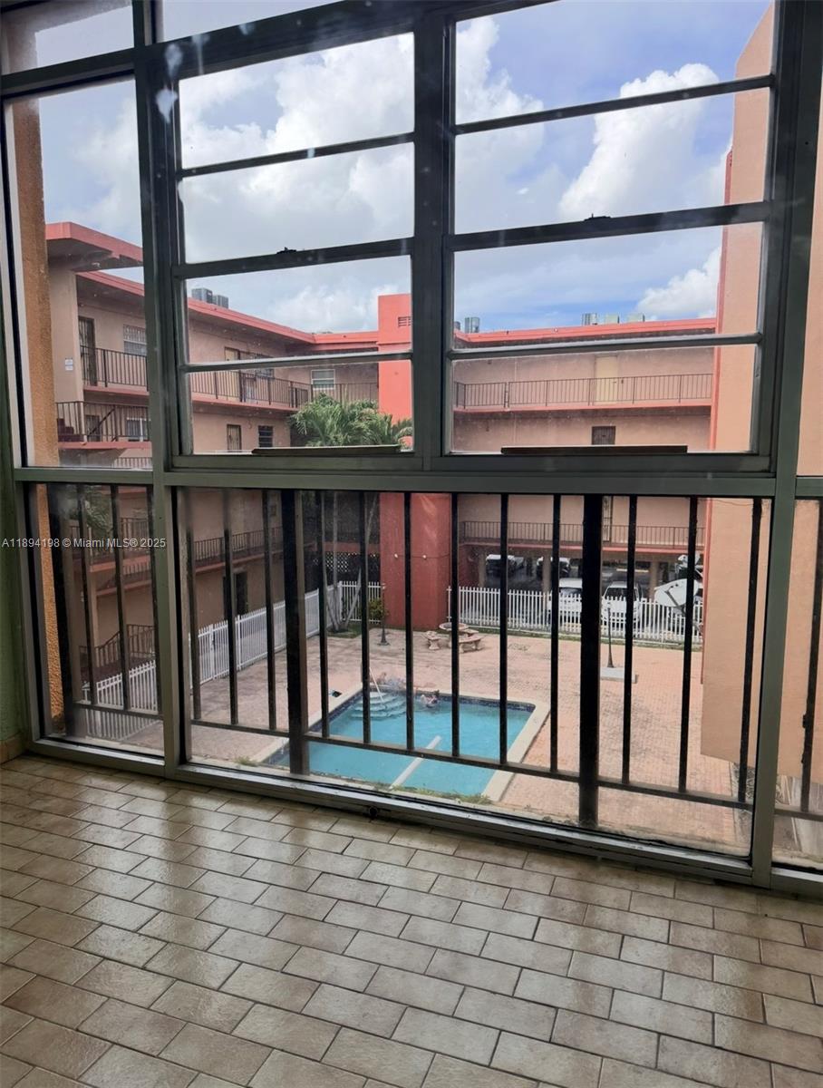 6055 West 19th Avenue, Unit 304 Hialeah, FL 33012 - Photo 14 of 24 a view of front door