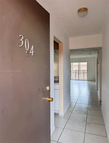 a view of a hallway with closet