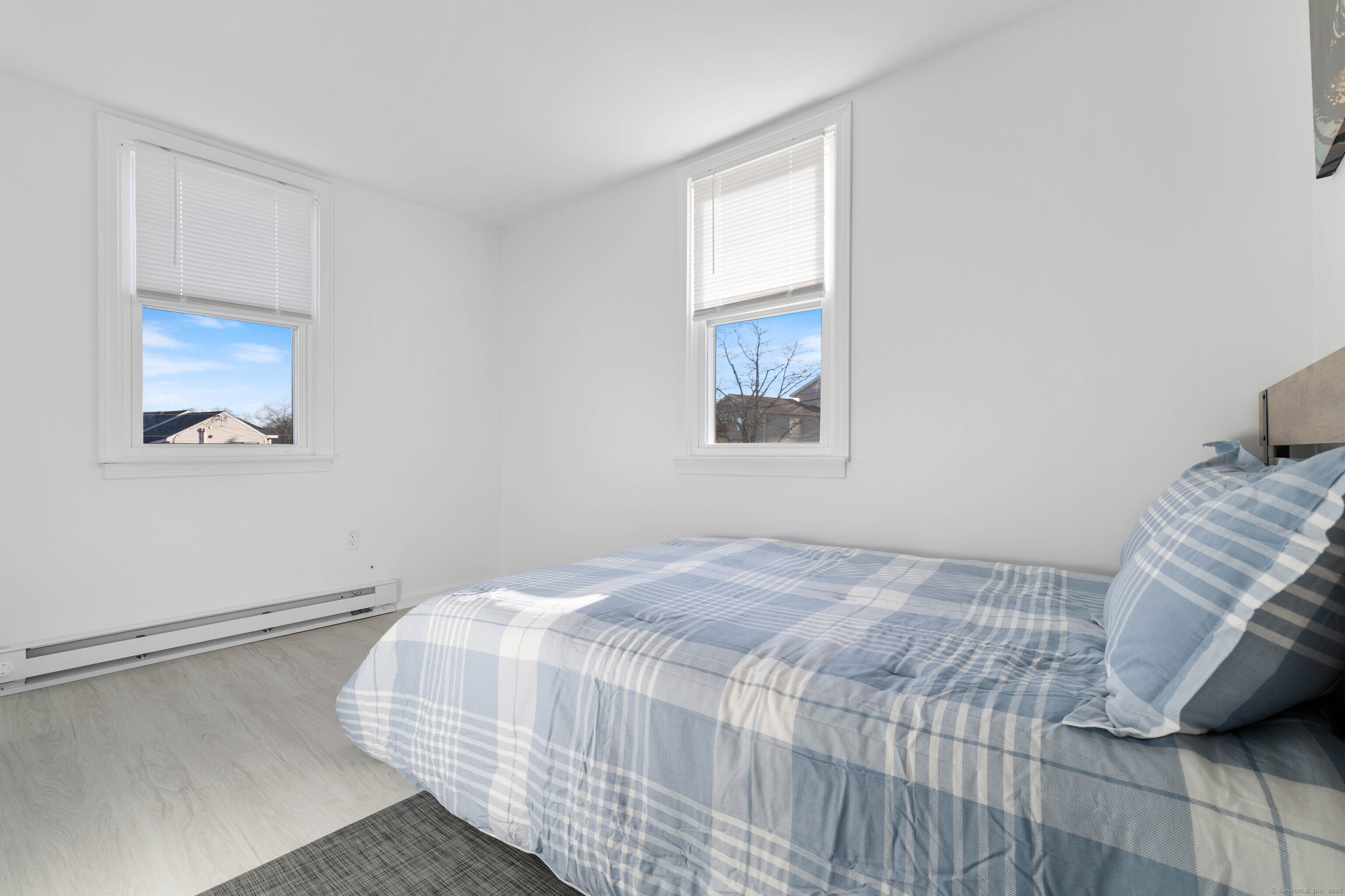 176 Shore Road Clinton, CT 06413 - Photo 15 of 40 a bedroom with a bed and a window