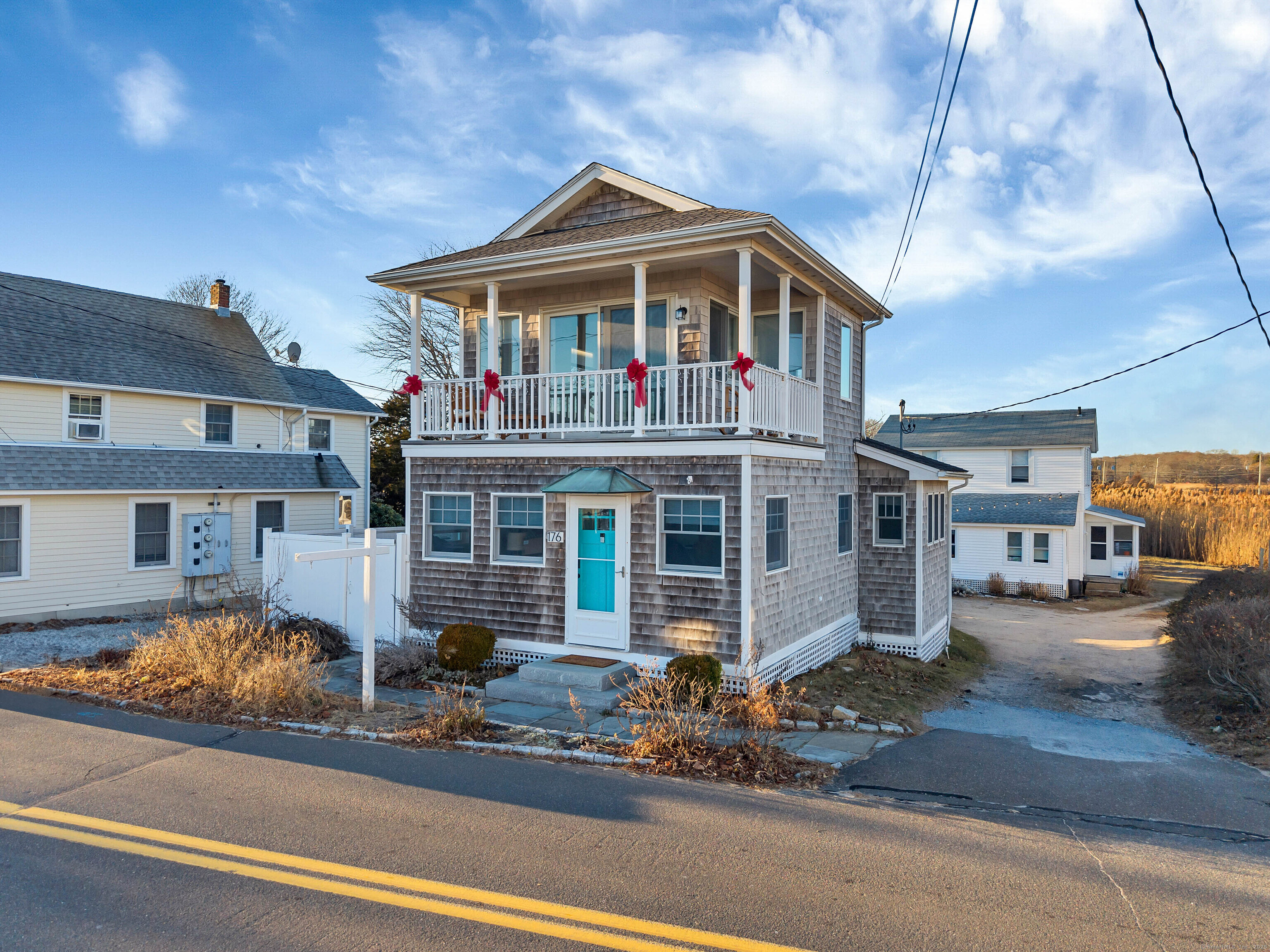 176 Shore Road Clinton, CT 06413 - Photo 21 of 40 a front view of a house with a yard