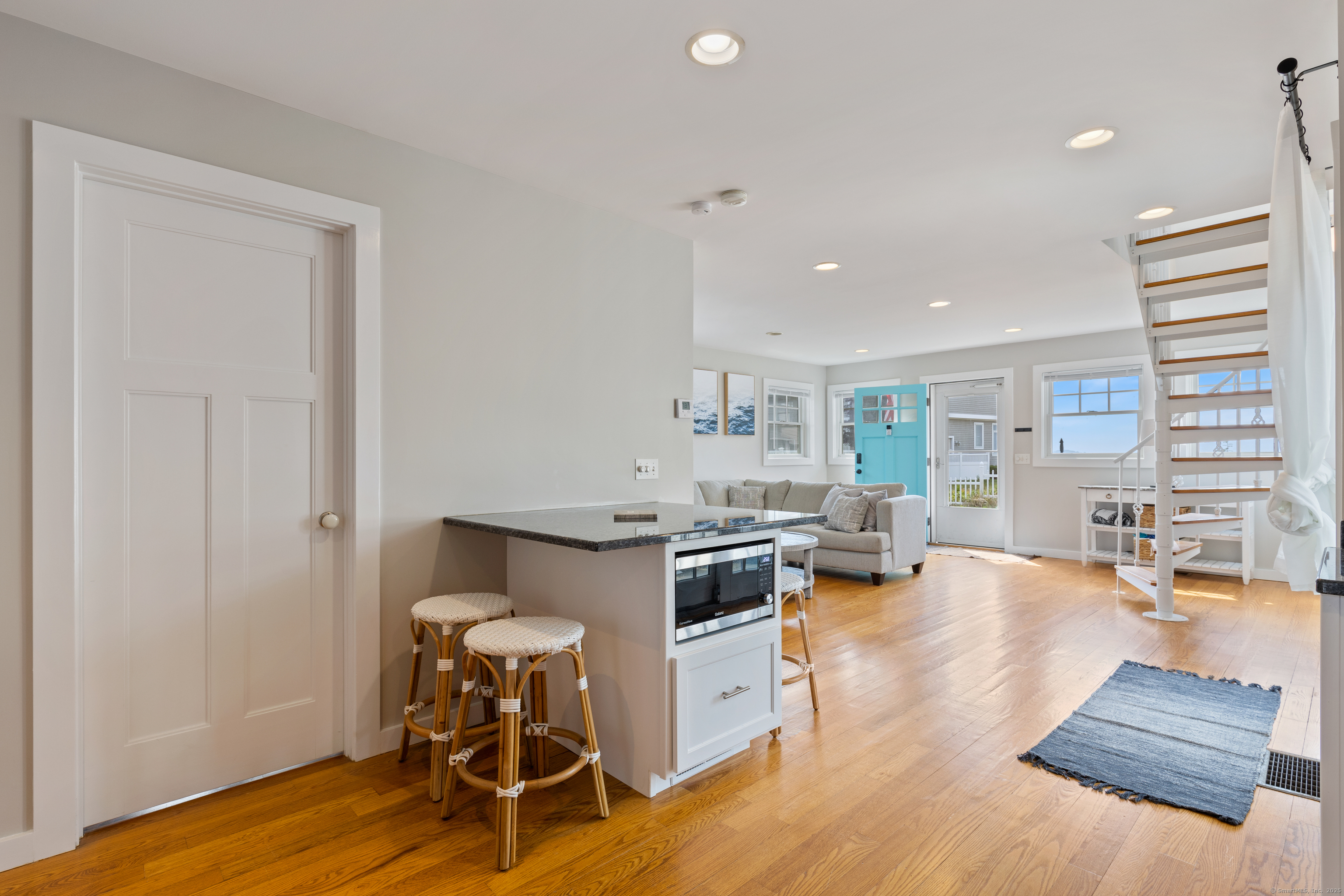 176 Shore Road Clinton, CT 06413 - Photo 26 of 40 a living room with furniture and wooden floor