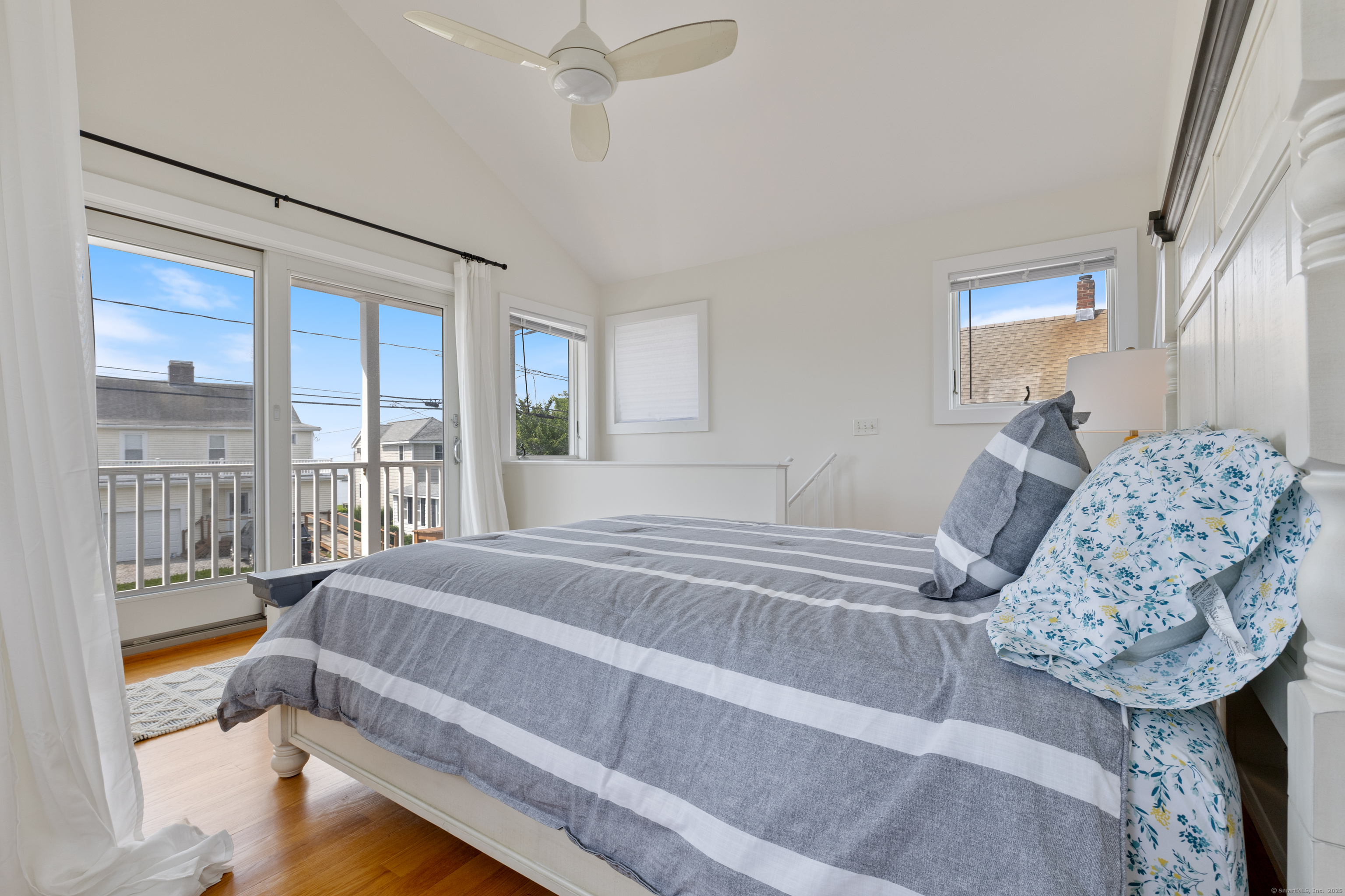 176 Shore Road Clinton, CT 06413 - Photo 30 of 40 a bedroom with a large bed and a window