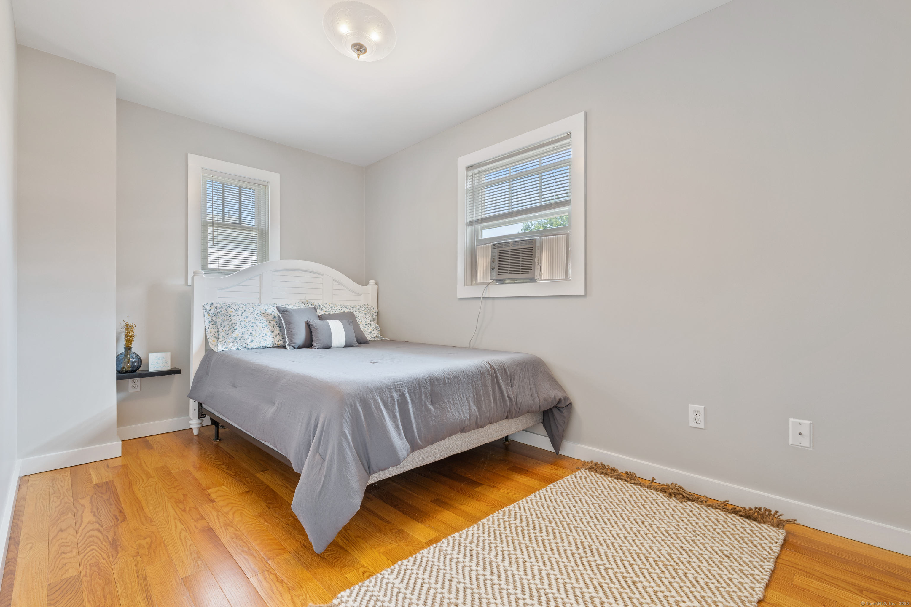 176 Shore Road Clinton, CT 06413 - Photo 8 of 40 a bedroom with a bed and a window