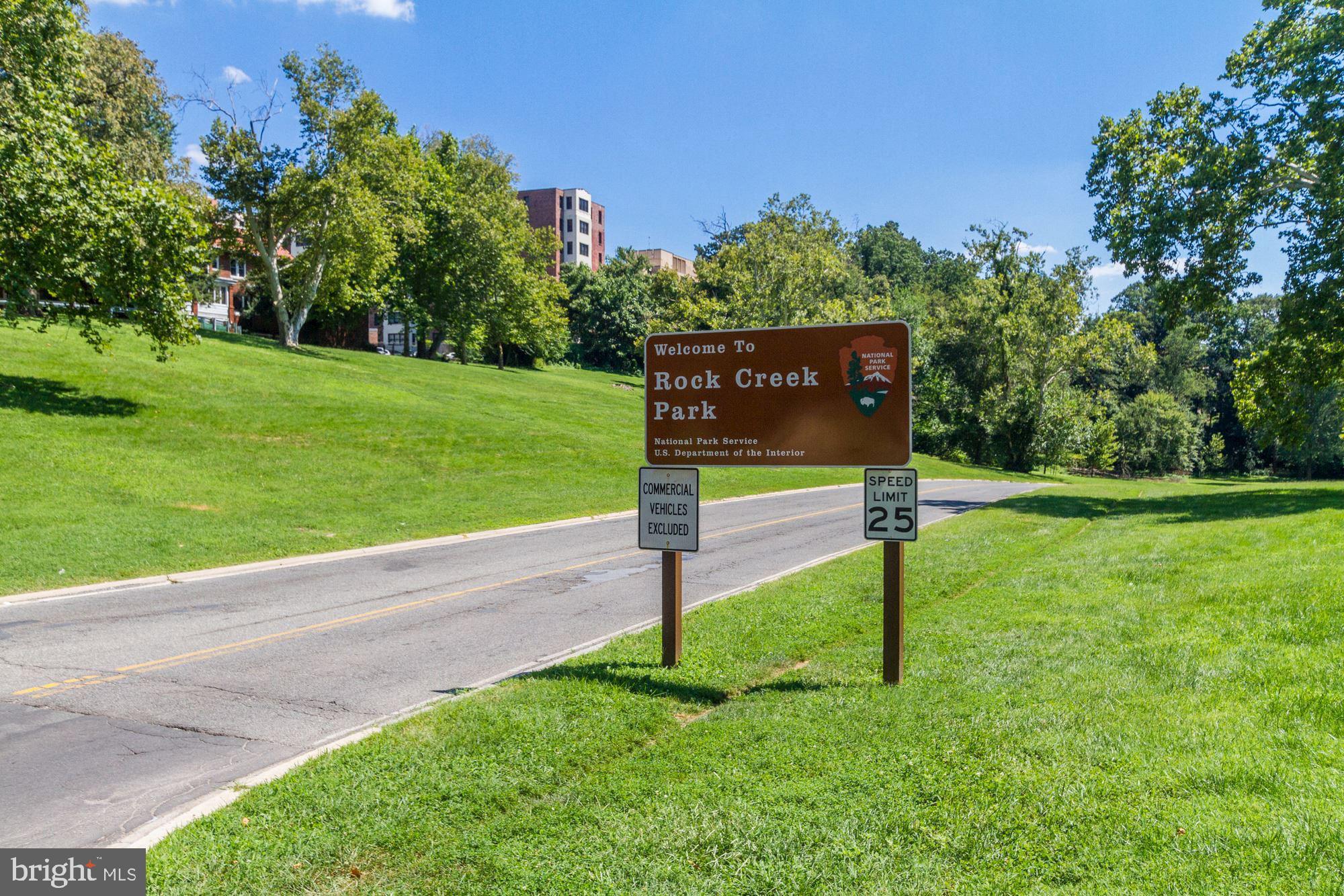 1021 Spring Road Northwest, Unit 1 Washington, DC 20010 - Photo 21 of 27 a sign board with grassy park