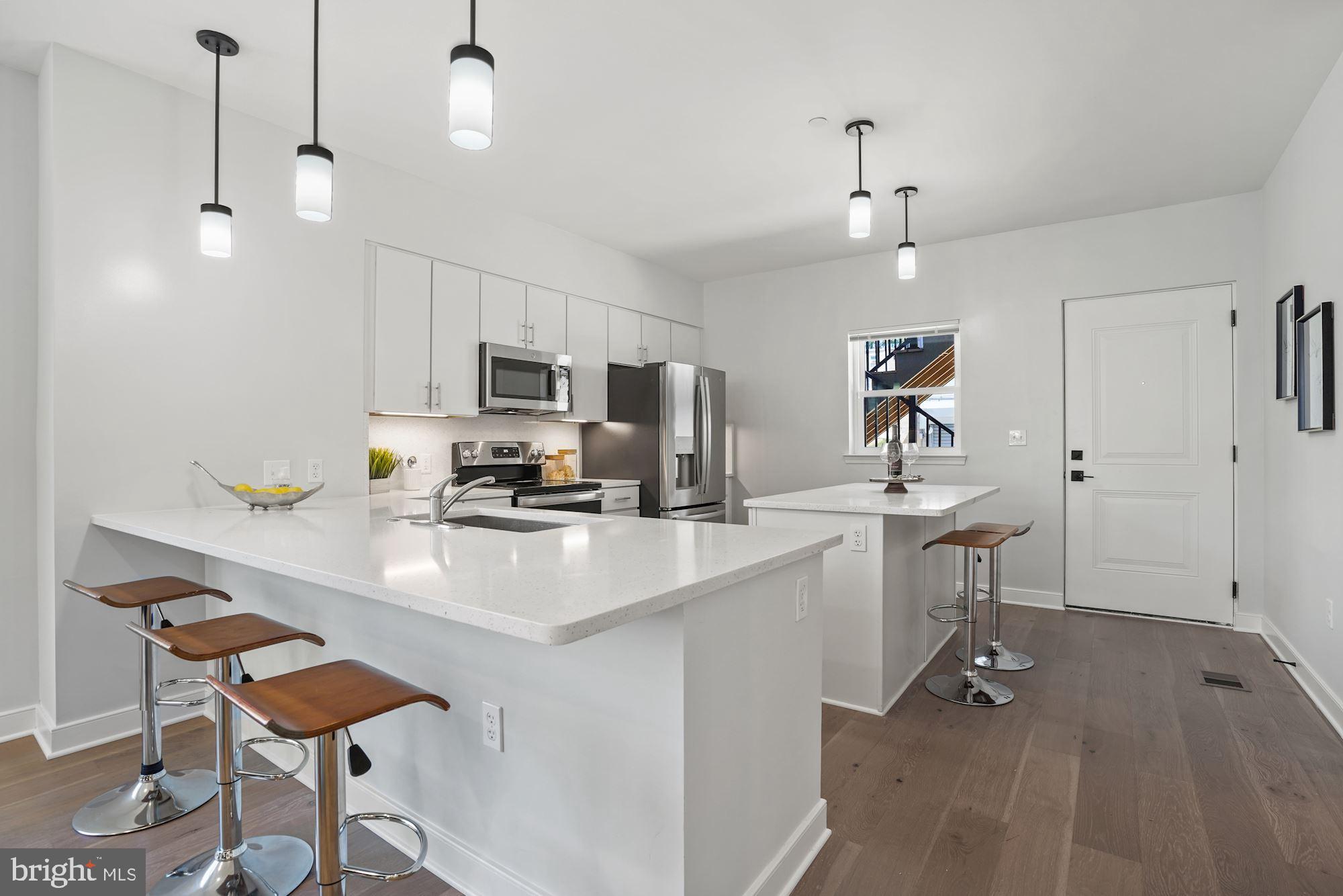 1021 Spring Road Northwest, Unit 1 Washington, DC 20010 - Photo 4 of 27 a kitchen with a sink cabinets and window