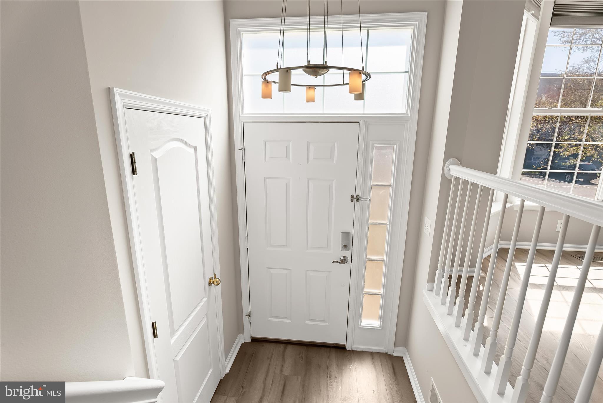 2631 Cameron Way Frederick, MD 21701 - Photo 16 of 86 a view of a hallway with wooden floor and stairs