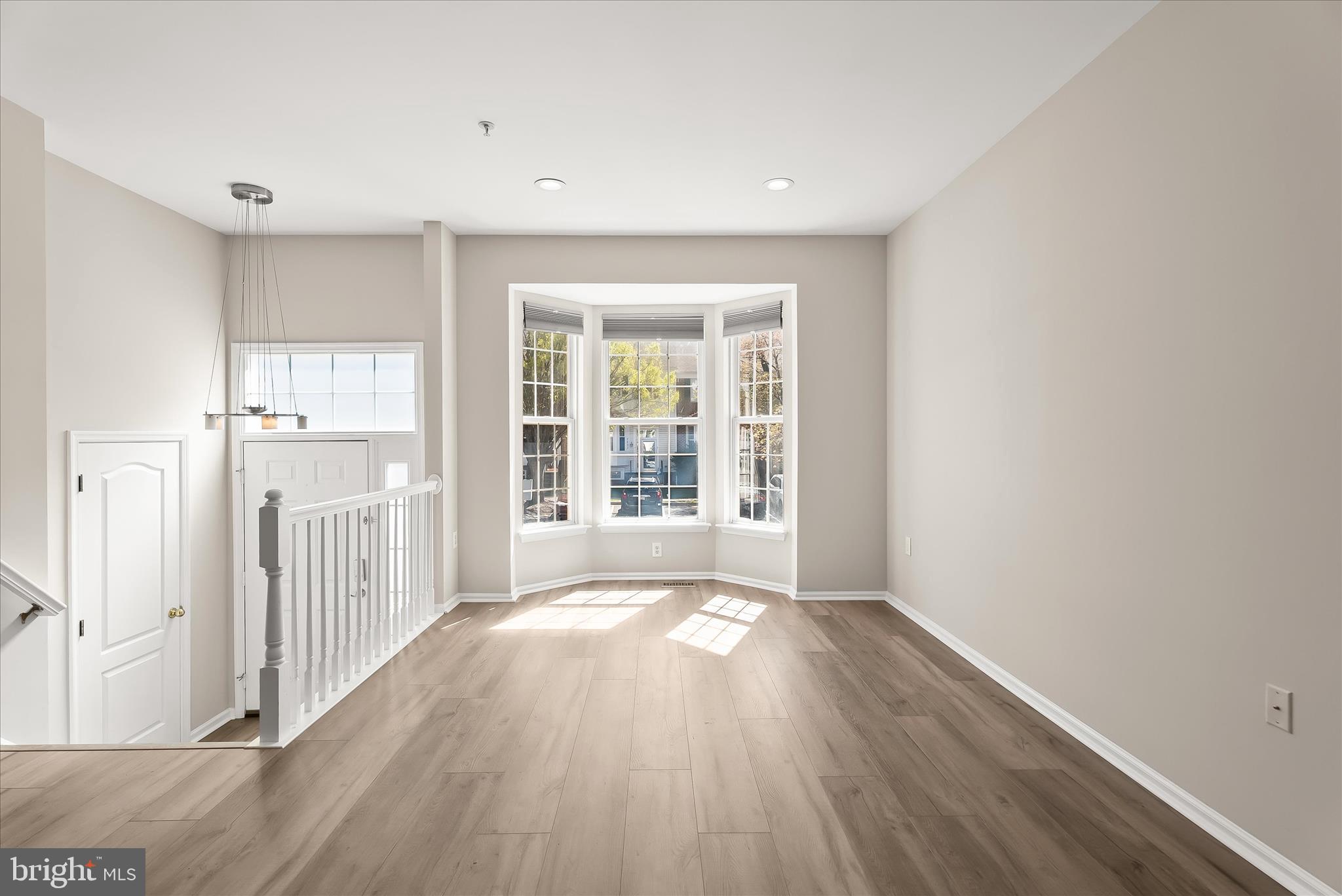 2631 Cameron Way Frederick, MD 21701 - Photo 17 of 86 a view of a big room with wooden floor and windows