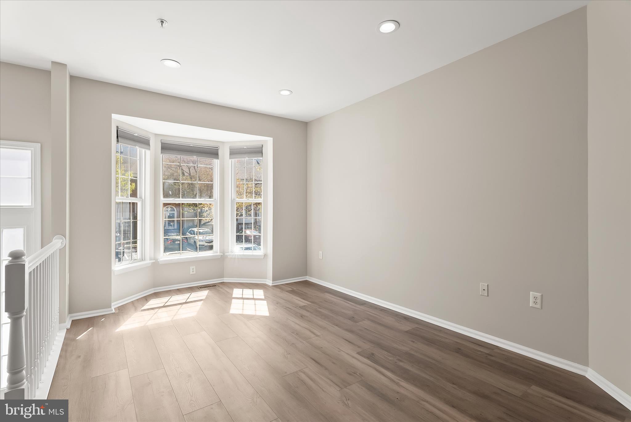 2631 Cameron Way Frederick, MD 21701 - Photo 19 of 86 an empty room with wooden floor and windows