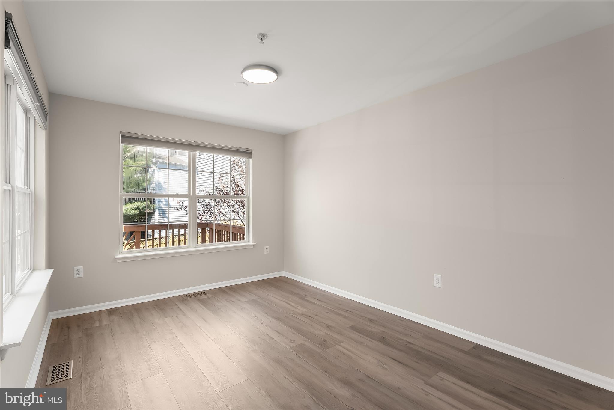 2631 Cameron Way Frederick, MD 21701 - Photo 26 of 86 an empty room with wooden floor and windows