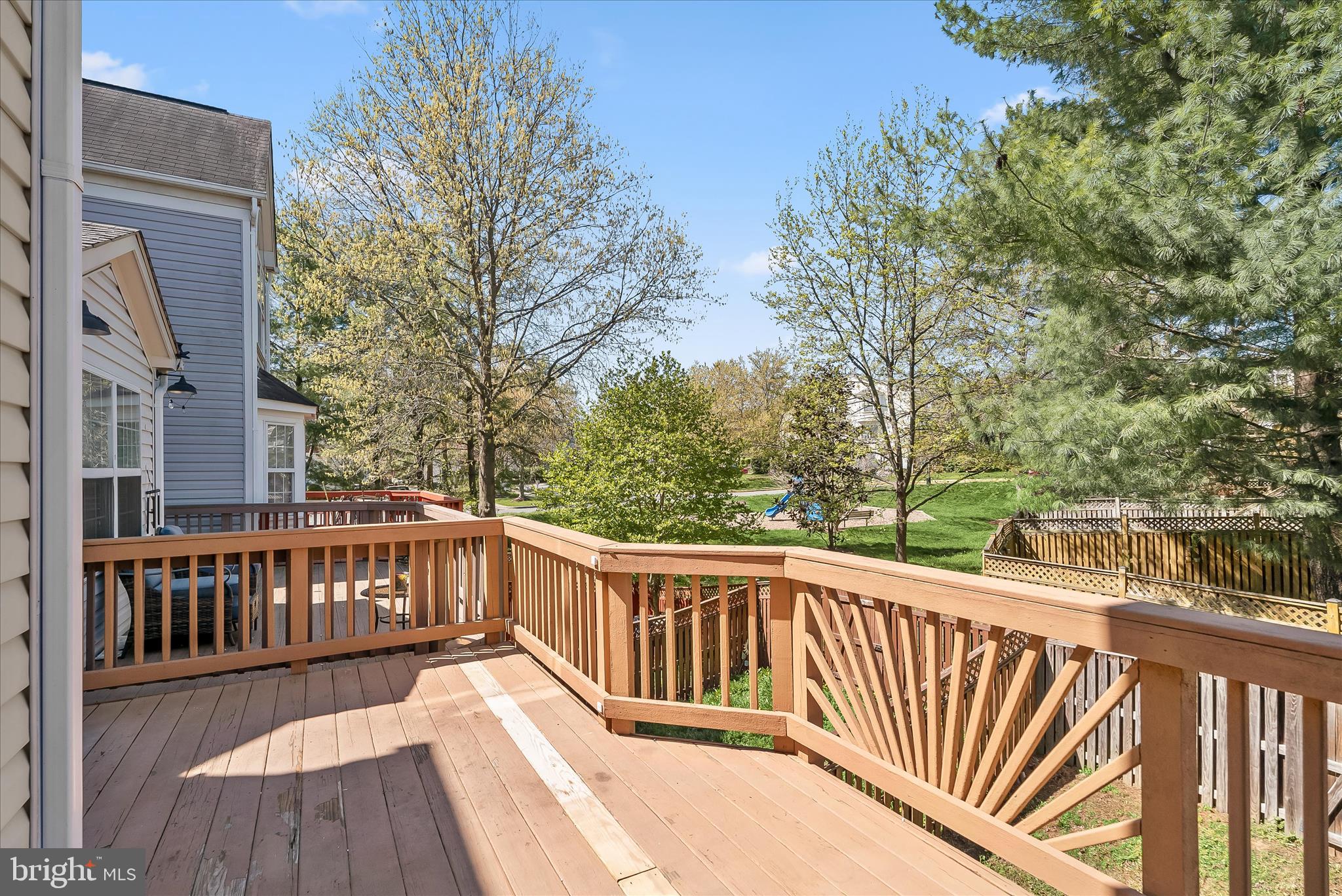 2631 Cameron Way Frederick, MD 21701 - Photo 29 of 86 a view of a wooden deck with large trees and wooden fence