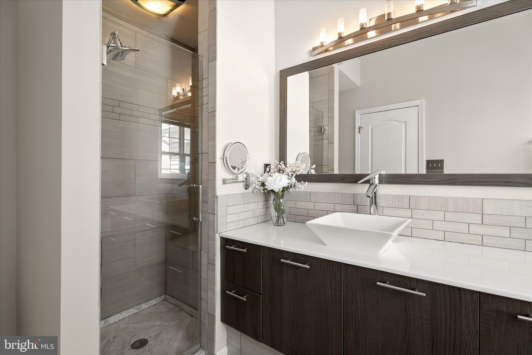 2631 Cameron Way Frederick, MD 21701 - Photo 40 of 86 a bathroom with a double vanity sink and a mirror