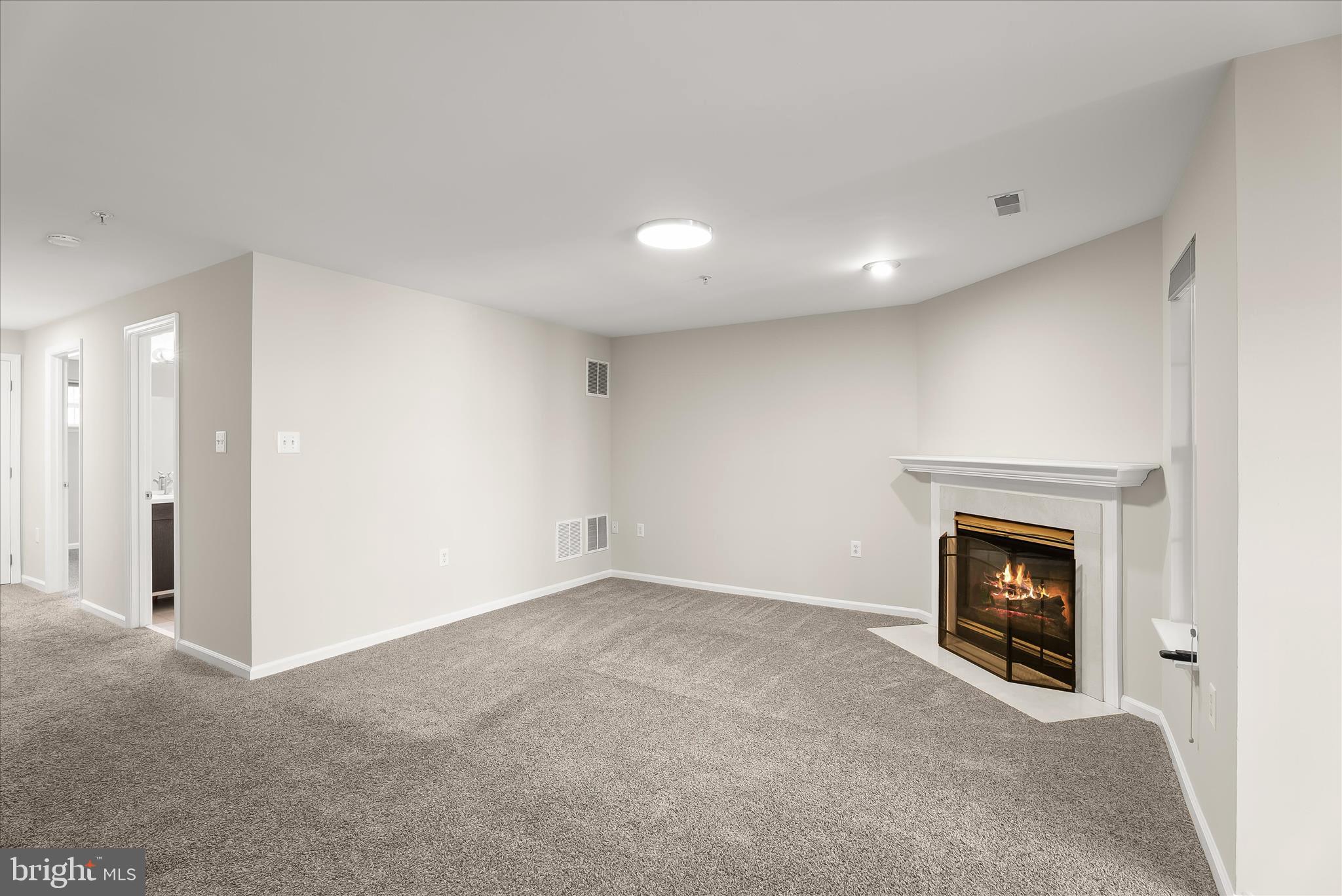 2631 Cameron Way Frederick, MD 21701 - Photo 58 of 86 a view of an empty room with fire place and a fireplace
