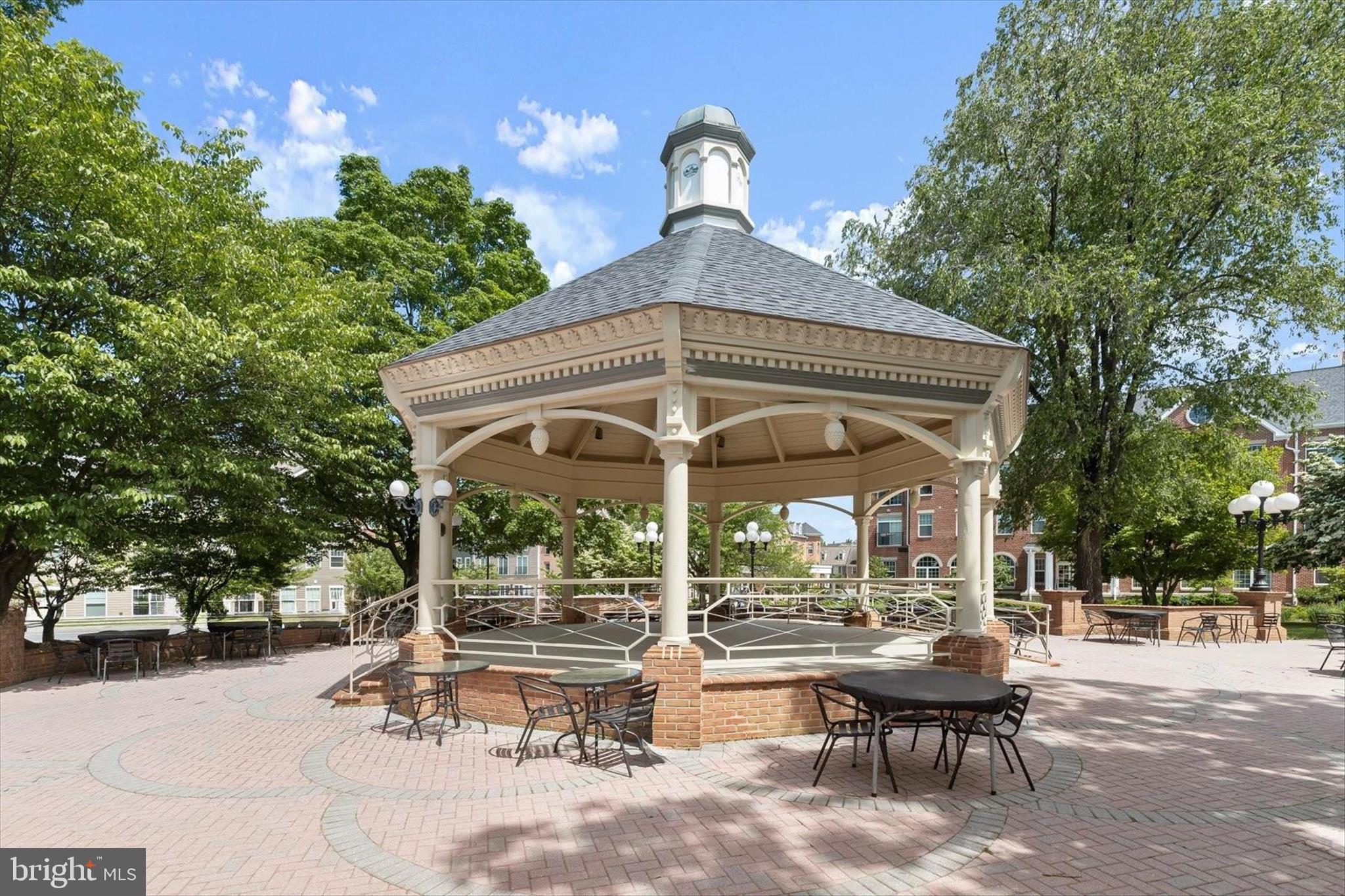 2631 Cameron Way Frederick, MD 21701 - Photo 80 of 86 a view of a patio with a table and chairs under an umbrella