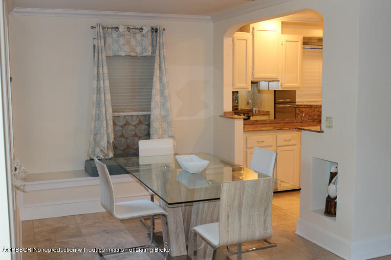 825 Sunset Road West Palm Beach, FL 33401 - Photo 2 of 12 a living room with furniture and a window