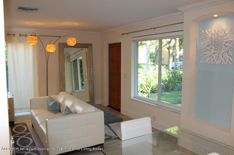 825 Sunset Road West Palm Beach, FL 33401 - Photo 11 of 12 a living room with furniture and a large window