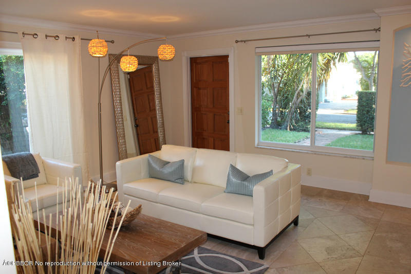 825 Sunset Road West Palm Beach, FL 33401 - Photo 12 of 12 a living room with furniture and a large window