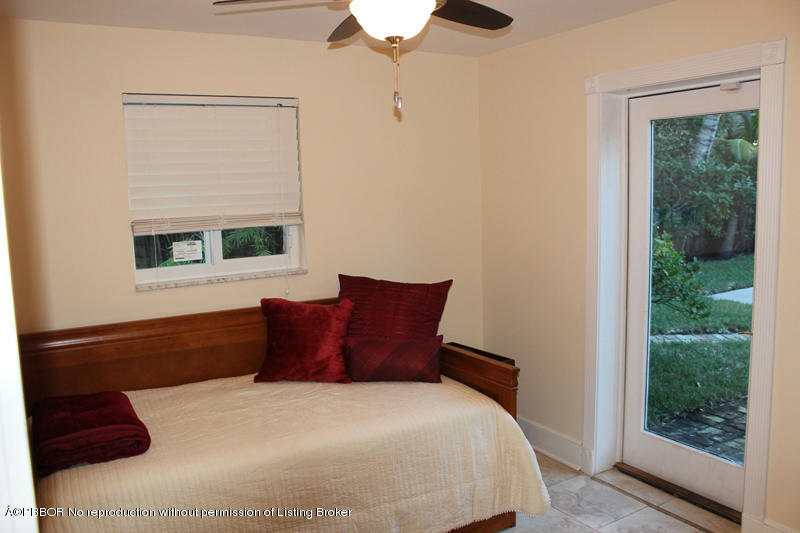 825 Sunset Road West Palm Beach, FL 33401 - Photo 5 of 12 a bedroom with a bed and a window