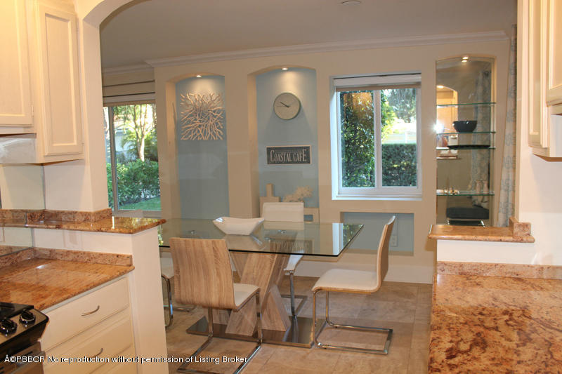 825 Sunset Road West Palm Beach, FL 33401 - Photo 10 of 12 a view of a dining room with furniture and windows
