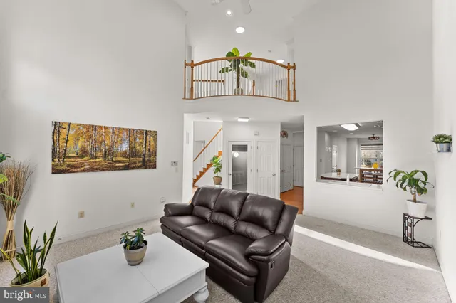 a living room with furniture and flowers