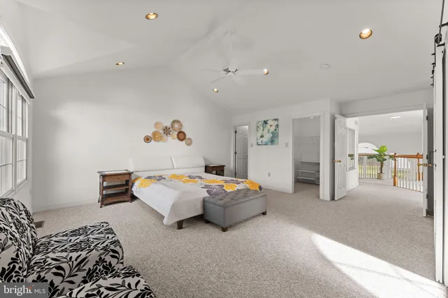 a bedroom with a bed and a couch