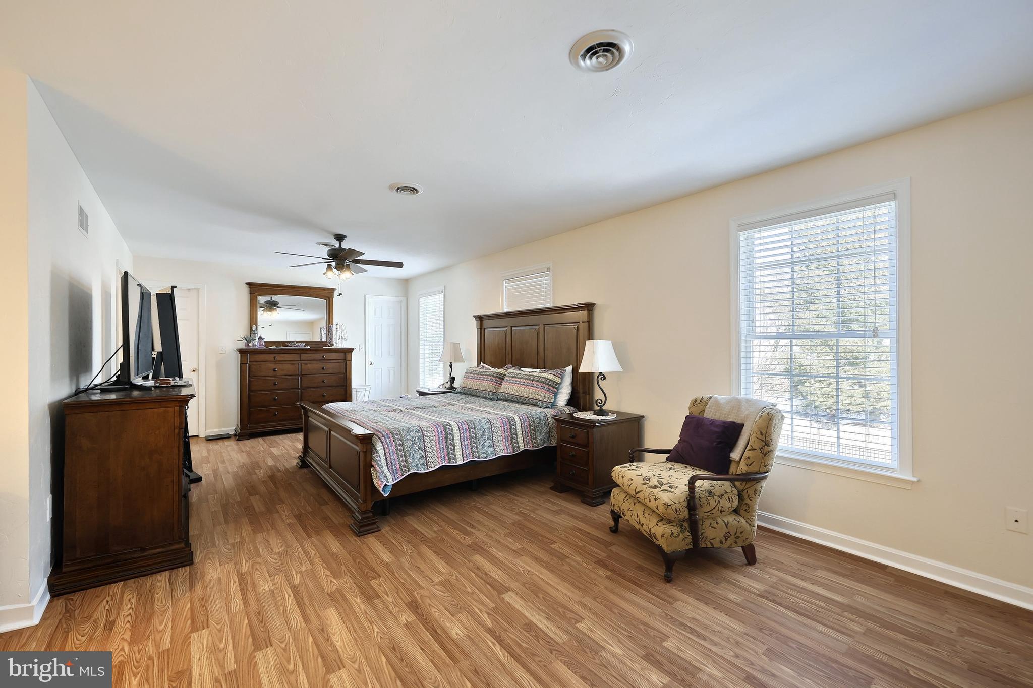 1 Hickory Lane Littlestown, PA 17340 - Photo 16 of 49 a spacious bedroom with a bed and wooden floor
